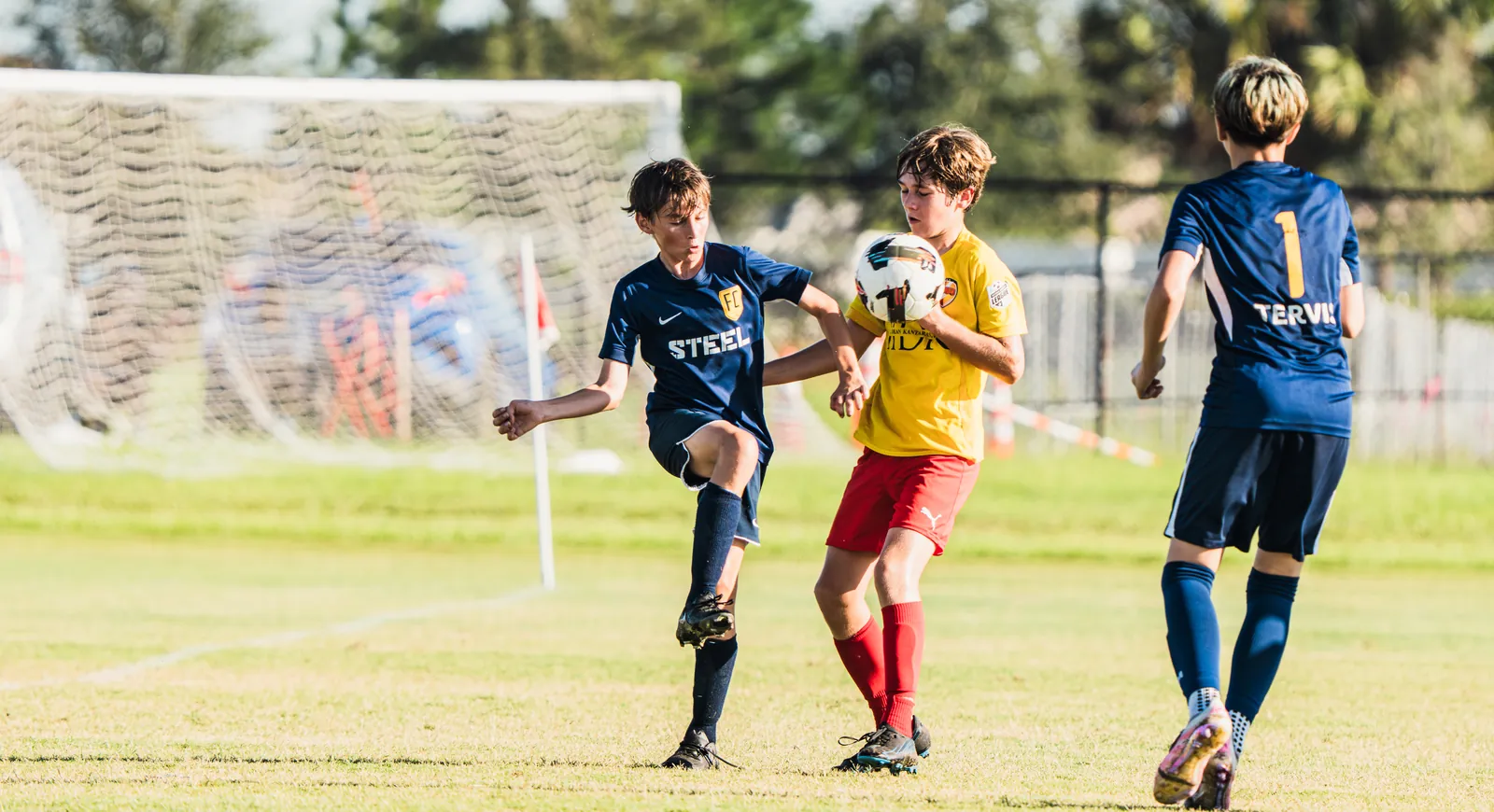 Young players competing for the ball at the Florida Easter Cup